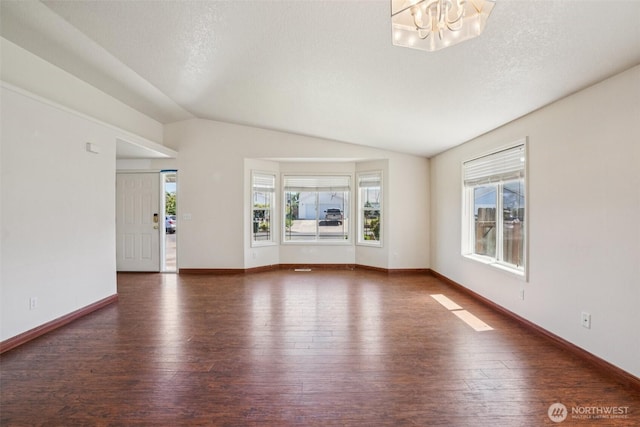 87 Chickadee Dr, Kelso, WA 98626 - unfurnished living room with hardwood / wood-style flooring, a chandelier, and lofted ceiling