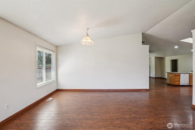 87 Chickadee Dr, Kelso, WA 98626 - spare room with dark wood-style floors, lofted ceiling, and recessed lighting
