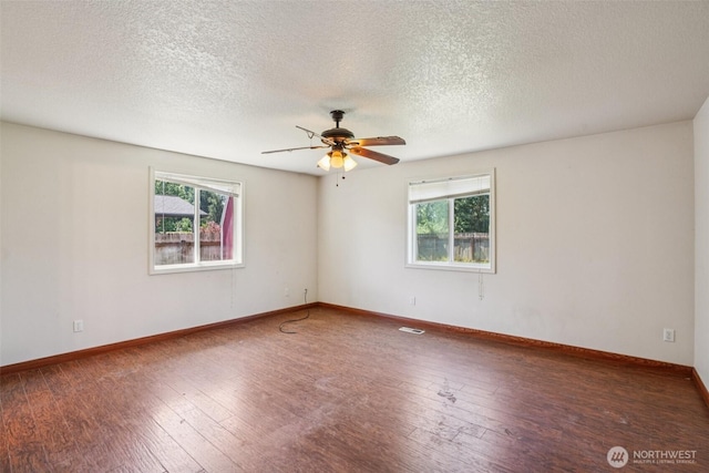 87 Chickadee Dr, Kelso, WA 98626 - unfurnished room featuring healthy amount of natural light, wood-type flooring, a ceiling fan, and a textured ceiling