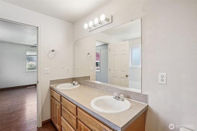 87 Chickadee Dr, Kelso, WA 98626 - full bathroom featuring double vanity, plenty of natural light, and wood finished floors