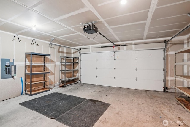 87 Chickadee Dr, Kelso, WA 98626 - garage featuring electric panel and a garage door opener