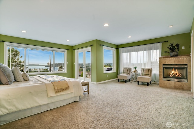 1425 S Sunset Dr, Tacoma, WA 98465 - carpeted bedroom featuring multiple windows, access to outside, a fireplace, and recessed lighting