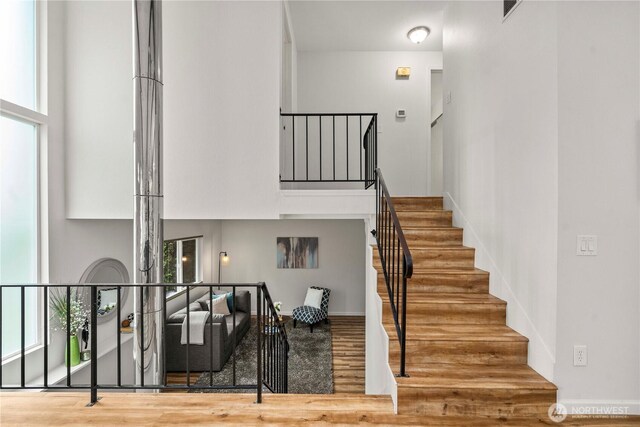4209 S 297th Pl, Auburn, WA 98001 - staircase featuring wood finished floors and a high ceiling