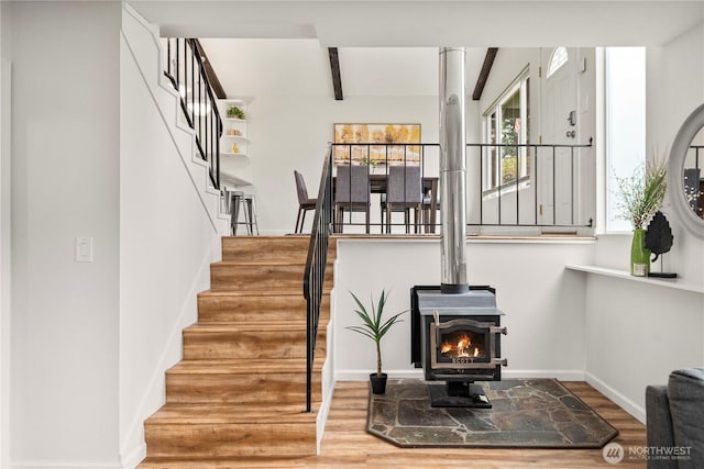 4209 S 297th Pl, Auburn, WA 98001 - stairs featuring wood finished floors, a wood stove, and beamed ceiling