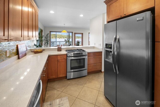 13190 Riviera Pl NE, Seattle, WA 98125 - kitchen featuring stainless steel appliances, tasteful backsplash, brown cabinetry, recessed lighting, and a peninsula