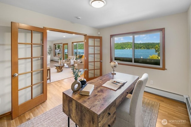 13190 Riviera Pl NE, Seattle, WA 98125 - office area with french doors, light wood-style flooring, and a baseboard heating unit