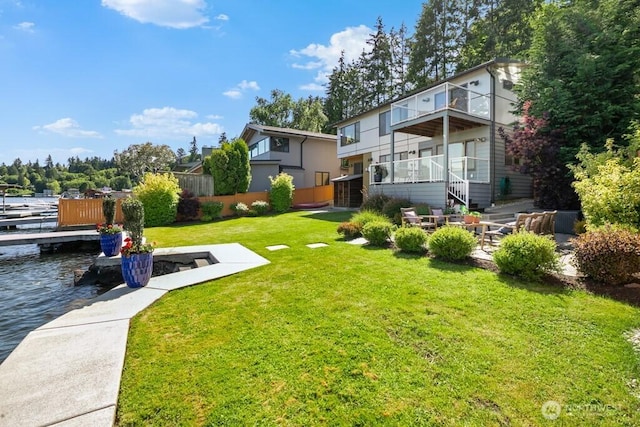 13190 Riviera Pl NE, Seattle, WA 98125 - view of grassy yard with a water view, a dock, and a balcony