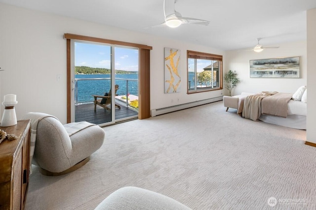 13190 Riviera Pl NE, Seattle, WA 98125 - bedroom with a baseboard heating unit, carpet flooring, access to exterior, ceiling fan, and a water view