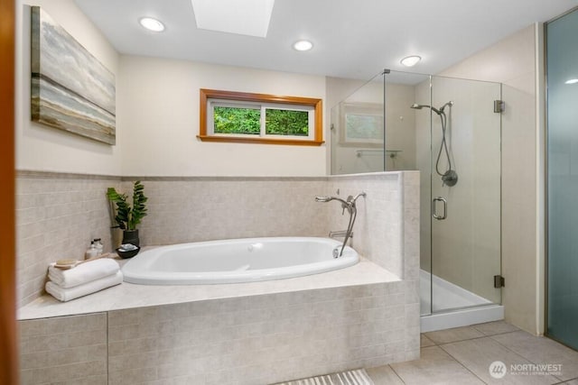 13190 Riviera Pl NE, Seattle, WA 98125 - bathroom featuring a stall shower, tile patterned flooring, a garden tub, and a skylight