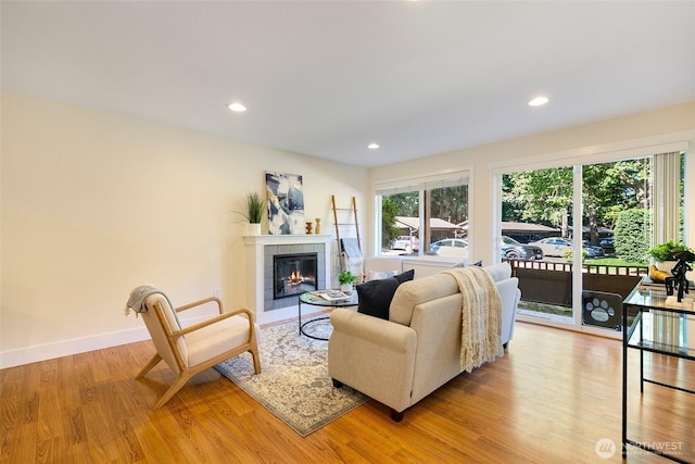 21307 48th Ave W Unit C211, Mountlake Terrace, WA 98043 - living area featuring light wood finished floors, a tile fireplace, and recessed lighting
