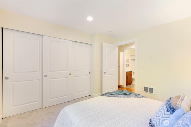 21307 48th Ave W Unit C211, Mountlake Terrace, WA 98043 - bedroom featuring a closet, light carpet, and recessed lighting