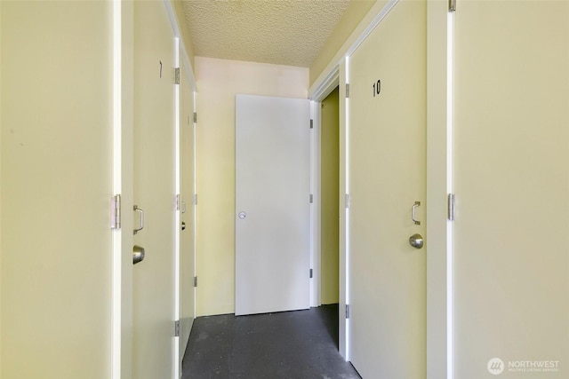21307 48th Ave W Unit C211, Mountlake Terrace, WA 98043 - hall featuring a textured ceiling