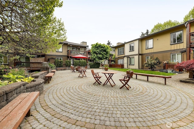 21307 48th Ave W Unit C211, Mountlake Terrace, WA 98043 - view of property's community with a patio, outdoor dining area, and a residential view