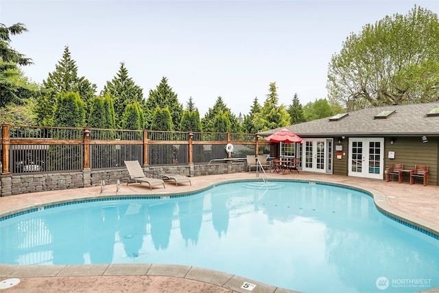 21307 48th Ave W Unit C211, Mountlake Terrace, WA 98043 - community pool with french doors, a patio area, and a fenced backyard