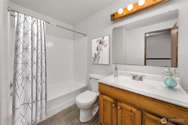 23 S 338th Pl, Federal Way, WA 98003 - full bathroom with wood finished floors, vanity, and shower / tub combo