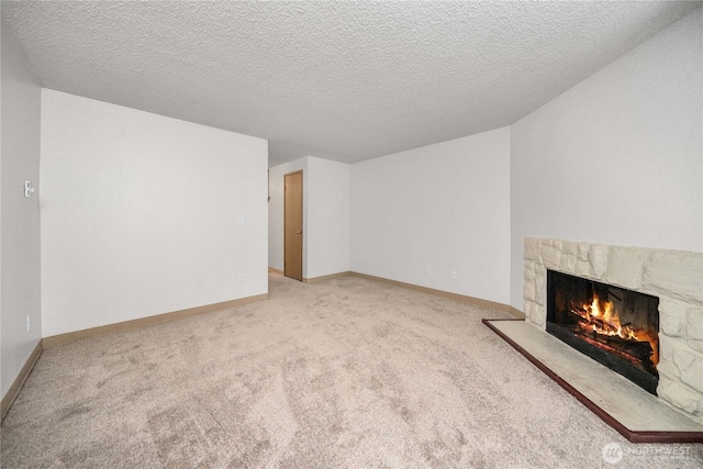 23 S 338th Pl, Federal Way, WA 98003 - unfurnished living room with a stone fireplace, carpet flooring, and a textured ceiling
