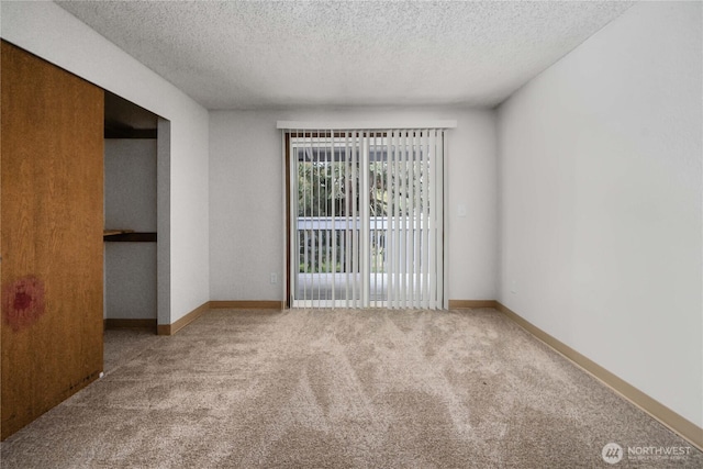 23 S 338th Pl, Federal Way, WA 98003 - spare room featuring carpet floors and a textured ceiling
