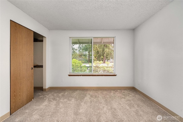 23 S 338th Pl, Federal Way, WA 98003 - unfurnished bedroom featuring carpet and a textured ceiling