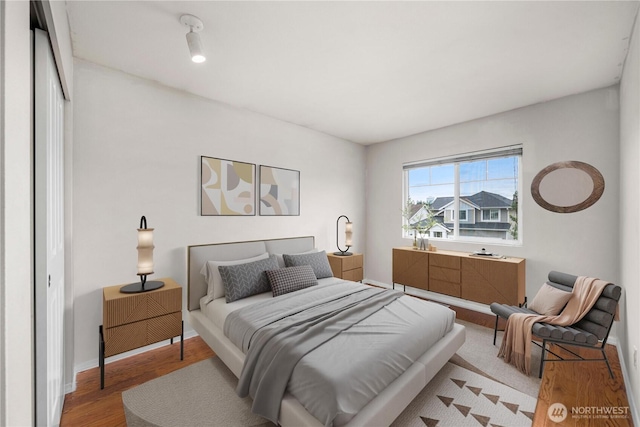 2101 62nd St SE, Auburn, WA 98092 - bedroom with light wood-type flooring and baseboards