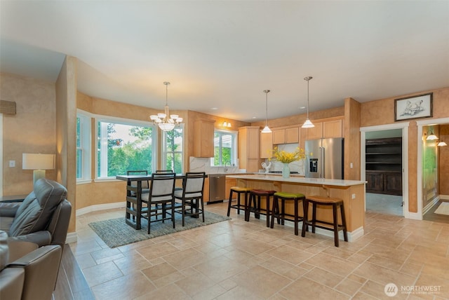1122 36th Ave NE, Olympia, WA 98506 - dining room featuring plenty of natural light, stone tile flooring, and a chandelier