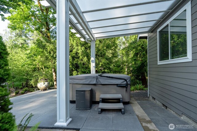1122 36th Ave NE, Olympia, WA 98506 - view of patio featuring a hot tub and a pergola