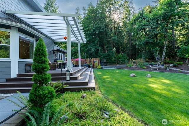 1122 36th Ave NE, Olympia, WA 98506 - view of grassy yard with a deck and a pergola