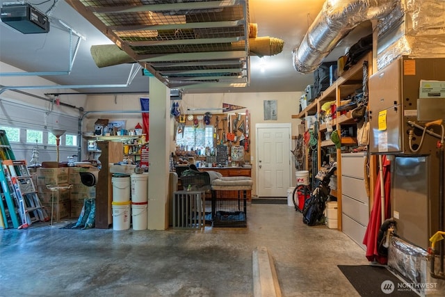 1122 36th Ave NE, Olympia, WA 98506 - garage featuring a garage door opener and a workshop area