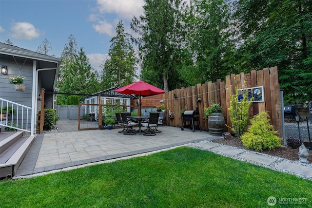 1122 36th Ave NE, Olympia, WA 98506 - fenced backyard featuring a patio area and grilling area