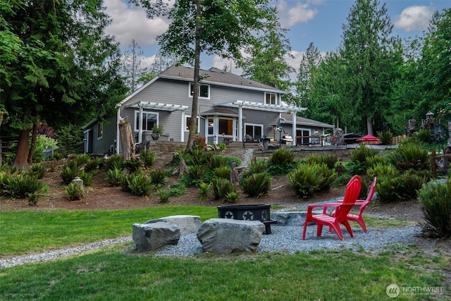 1122 36th Ave NE, Olympia, WA 98506 - back of property with a pergola, a lawn, a patio, and a fire pit