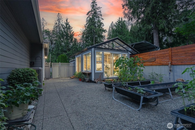 1122 36th Ave NE, Olympia, WA 98506 - fenced backyard with a vegetable garden and an outdoor structure