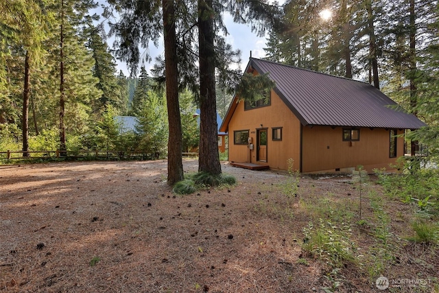 24302 Saddle St, Leavenworth, WA 98826 - view of side of home with a metal roof and crawl space