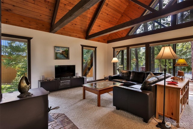24302 Saddle St, Leavenworth, WA 98826 - living room with light colored carpet, a wooden ceiling with exposed beams, plenty of natural light, and high vaulted ceiling