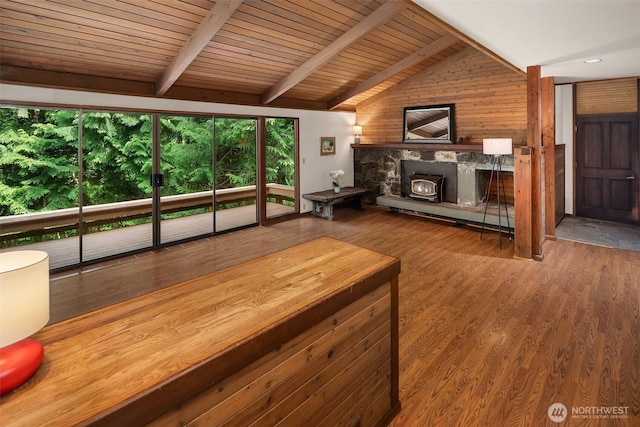 living room with wood finished floors, wood walls, and wood ceiling