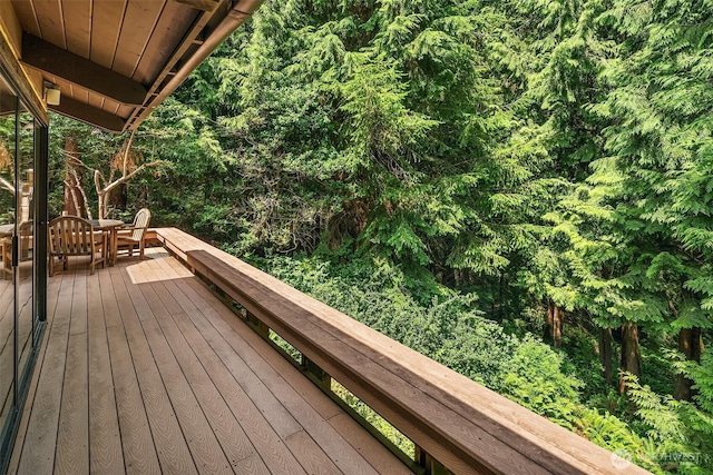 deck featuring a wooded view