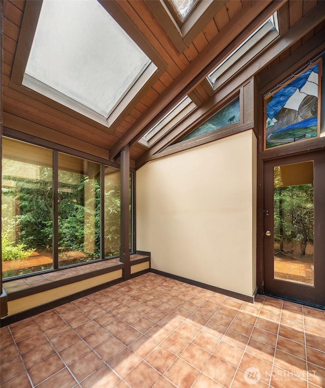 unfurnished sunroom with a skylight and plenty of natural light
