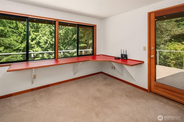 unfurnished office with carpet floors and baseboards