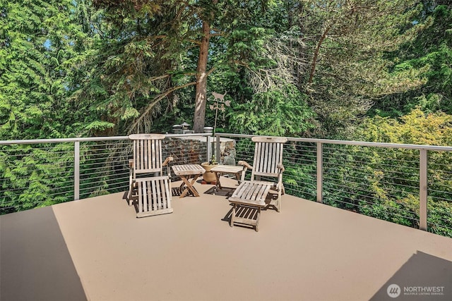 patio / terrace with a view of trees