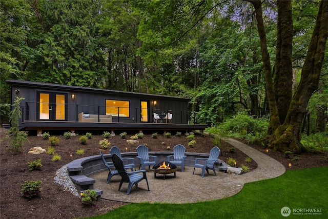 1524 Toe Jam Hill Rd NE, Bainbridge Island, WA 98110 - rear view of house with a fire pit, a patio, and a wooden deck