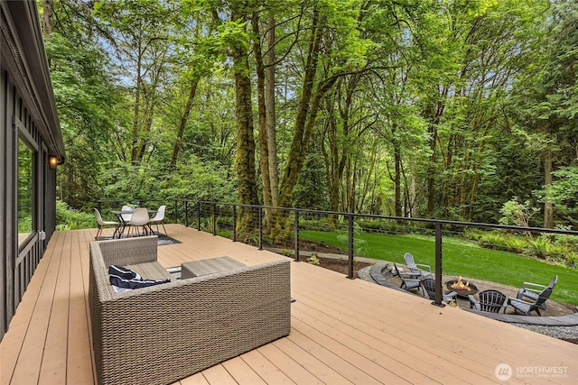 1524 Toe Jam Hill Rd NE, Bainbridge Island, WA 98110 - deck with an outdoor fire pit, outdoor dining area, and a lawn