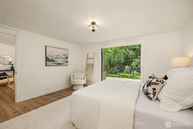 1524 Toe Jam Hill Rd NE, Bainbridge Island, WA 98110 - bedroom featuring wood finished floors and baseboards