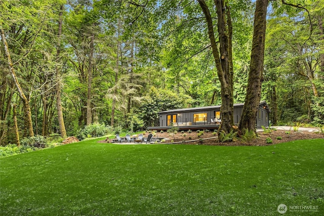 1524 Toe Jam Hill Rd NE, Bainbridge Island, WA 98110 - view of grassy yard featuring a view of trees and a wooden deck