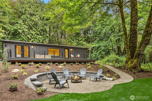 1524 Toe Jam Hill Rd NE, Bainbridge Island, WA 98110 - back of property with a fire pit, a deck, and a patio area