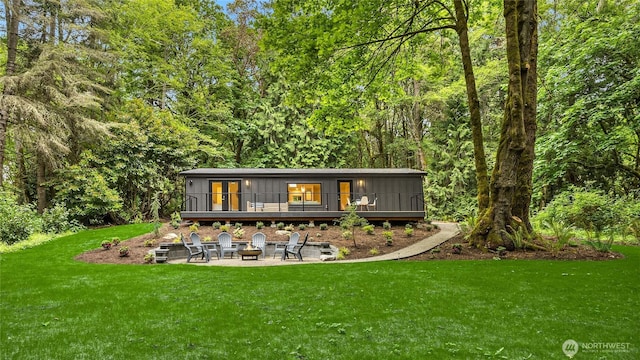1524 Toe Jam Hill Rd NE, Bainbridge Island, WA 98110 - back of house with an outdoor fire pit, a yard, a wooden deck, a patio, and french doors