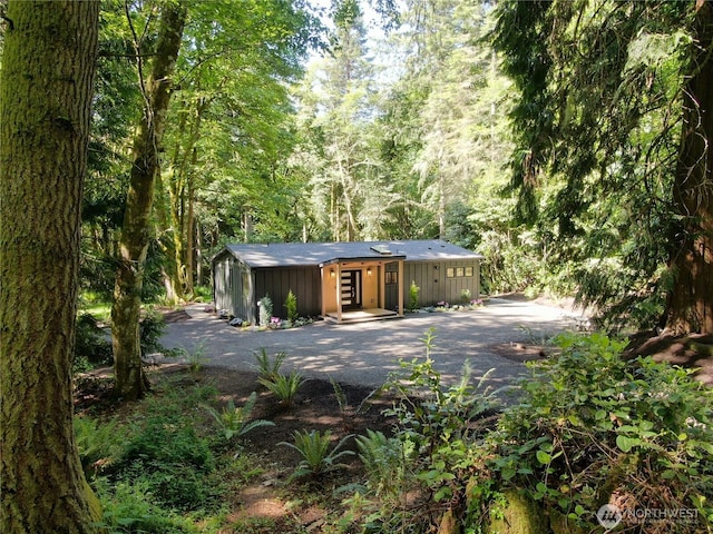 1524 Toe Jam Hill Rd NE, Bainbridge Island, WA 98110 - garage featuring a view of trees