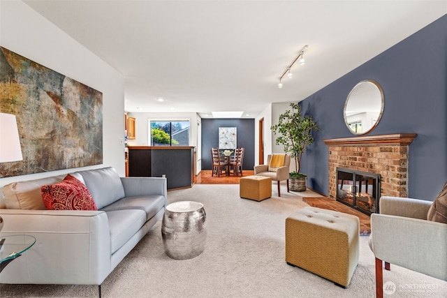 5040 Mill Pond Loop SE, Auburn, WA 98092 - carpeted living area with a brick fireplace