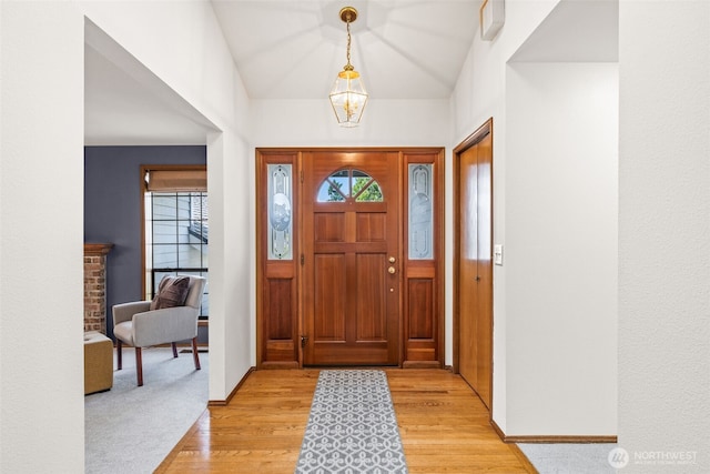 5040 Mill Pond Loop SE, Auburn, WA 98092 - entryway with plenty of natural light, light wood-style flooring, and vaulted ceiling