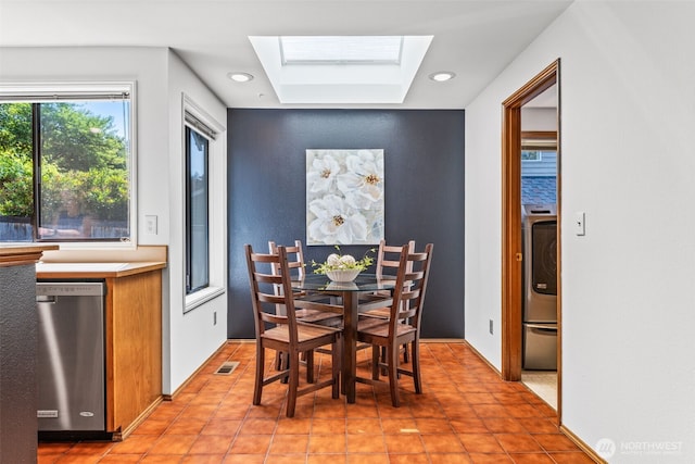 5040 Mill Pond Loop SE, Auburn, WA 98092 - dining room featuring a skylight, washer / clothes dryer, and light tile patterned floors