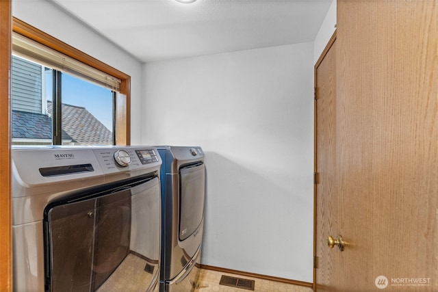 5040 Mill Pond Loop SE, Auburn, WA 98092 - laundry room with separate washer and dryer and baseboards