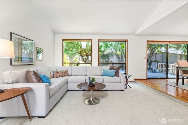 5040 Mill Pond Loop SE, Auburn, WA 98092 - carpeted living area with vaulted ceiling and healthy amount of natural light
