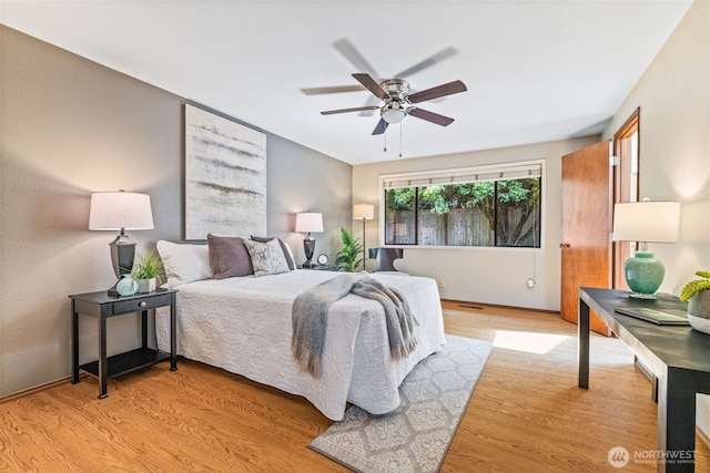 5040 Mill Pond Loop SE, Auburn, WA 98092 - bedroom featuring light wood-style flooring and ceiling fan